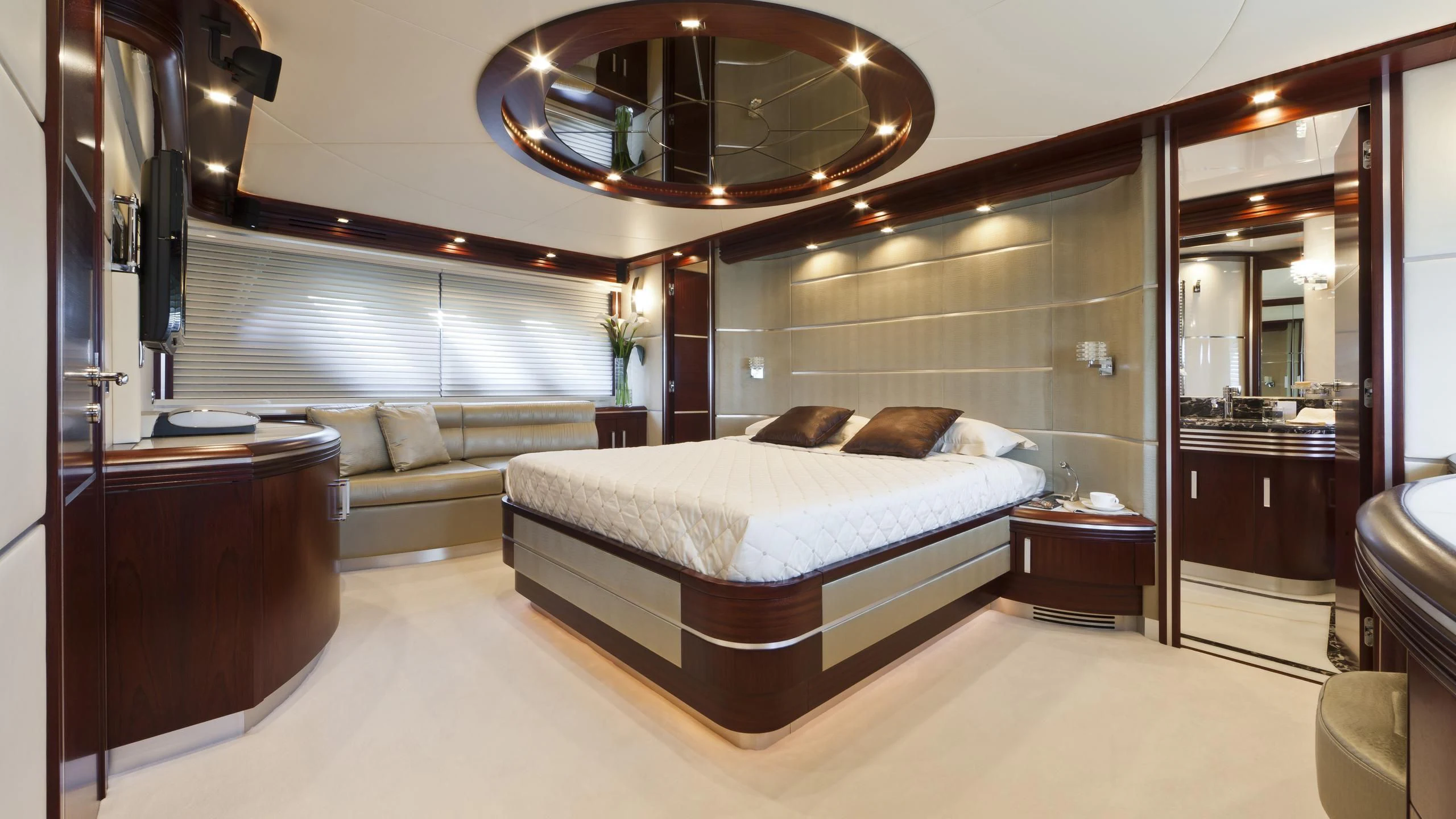 a large bedroom with a large bed aboard NASEEM Yacht for Sale