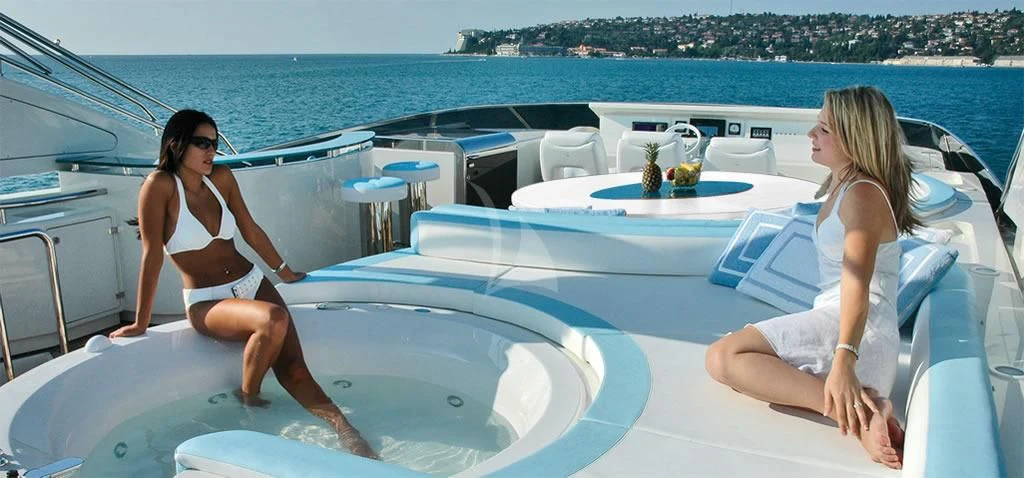 two women sitting on a boat aboard NASEEM Yacht for Sale