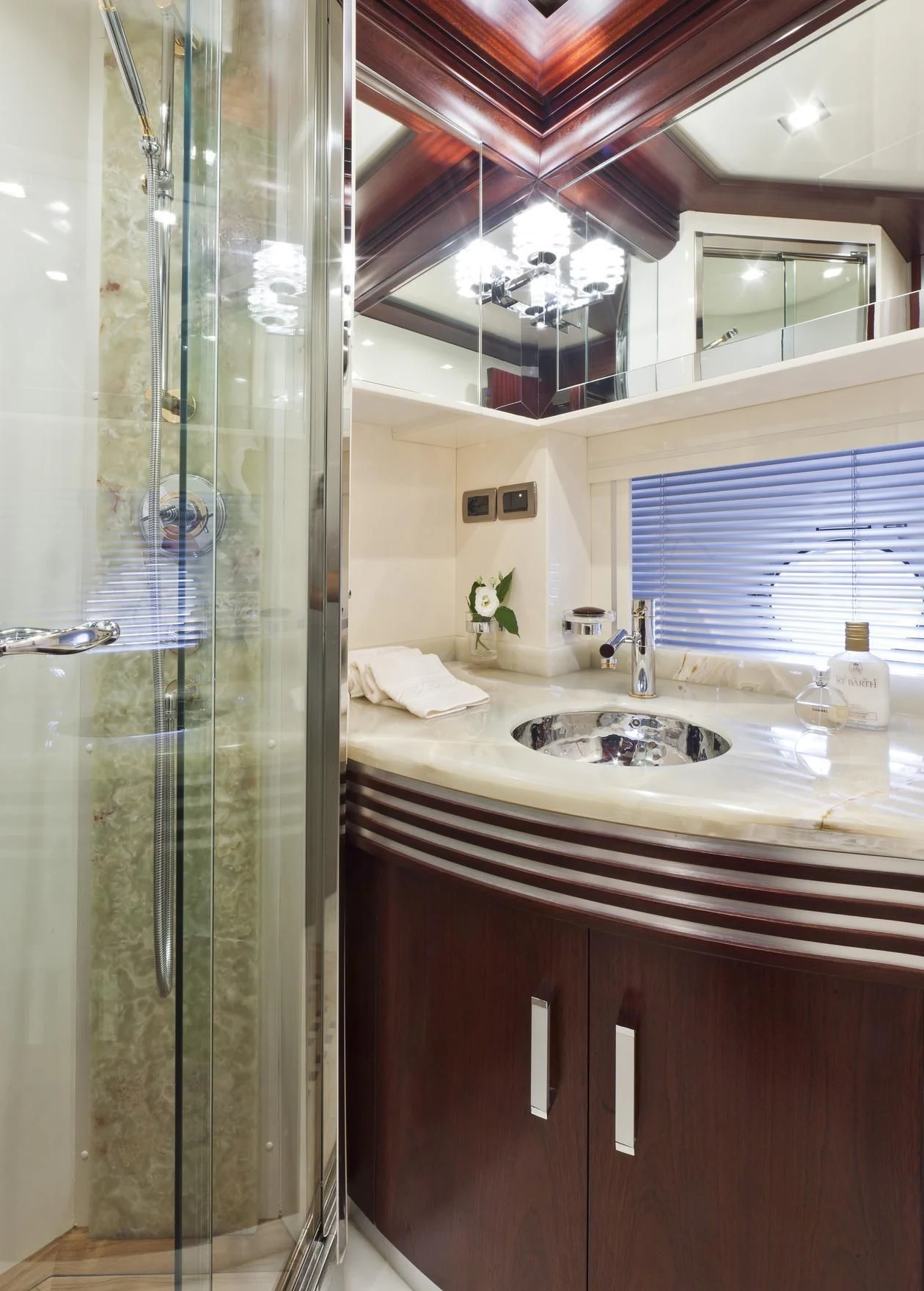 a bathroom with a glass shower aboard NASEEM Yacht for Sale