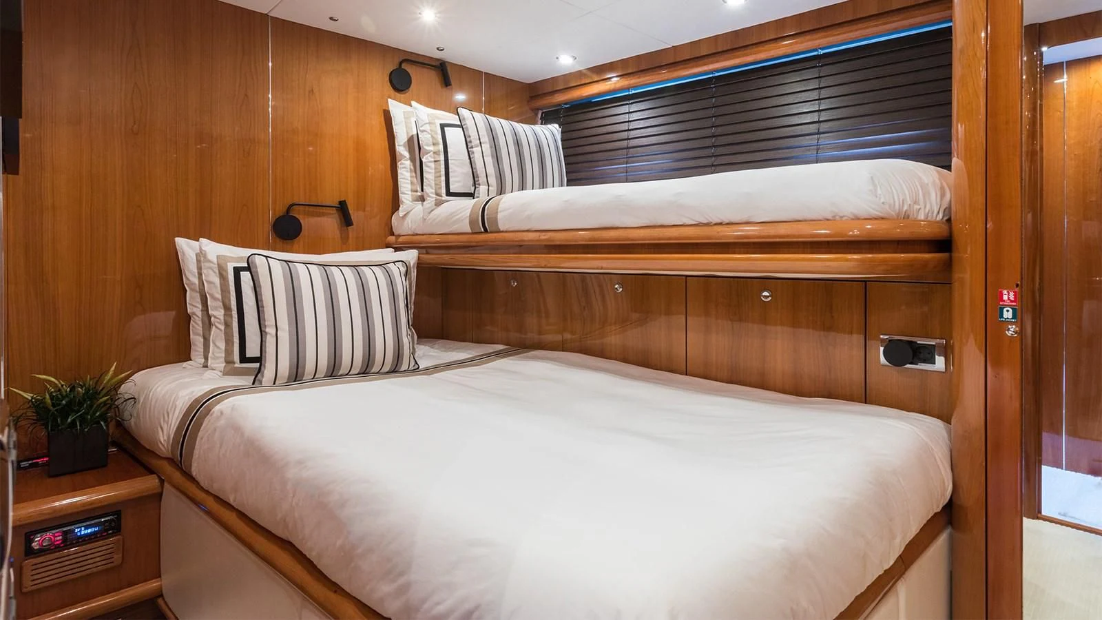 a room with a bed and a window aboard WINNING STREAK 2 Yacht for Sale