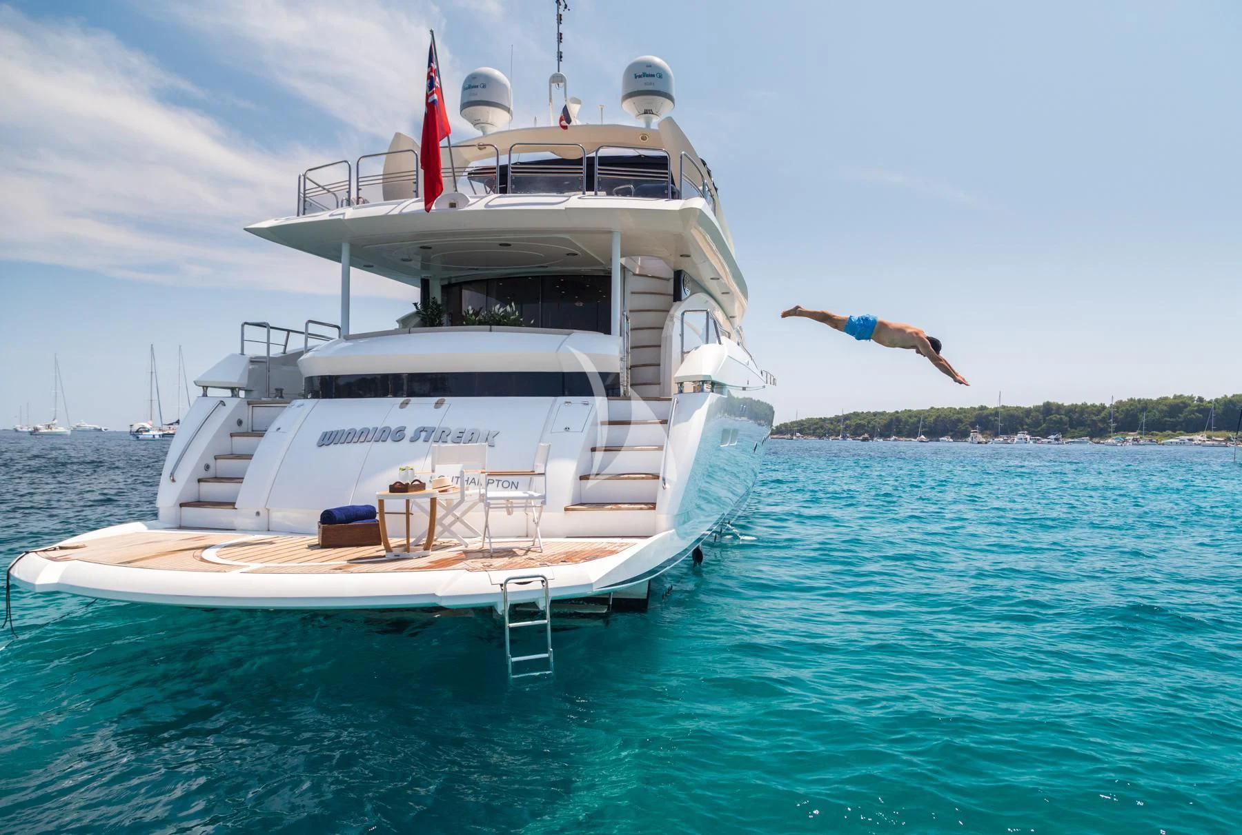 a person standing on a boat aboard WINNING STREAK 2 Yacht for Sale