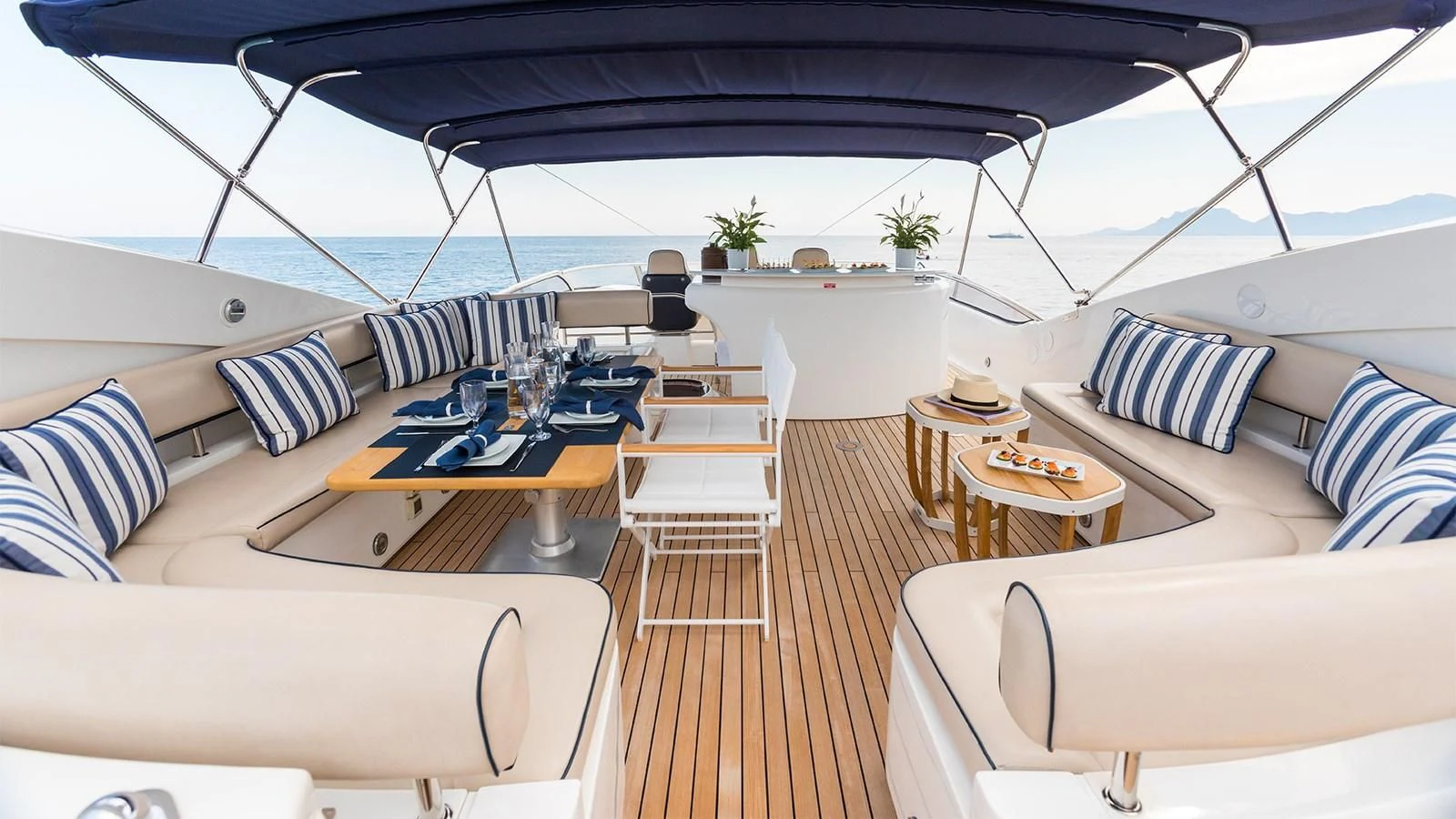 a lounge area with a table and chairs aboard WINNING STREAK 2 Yacht for Sale