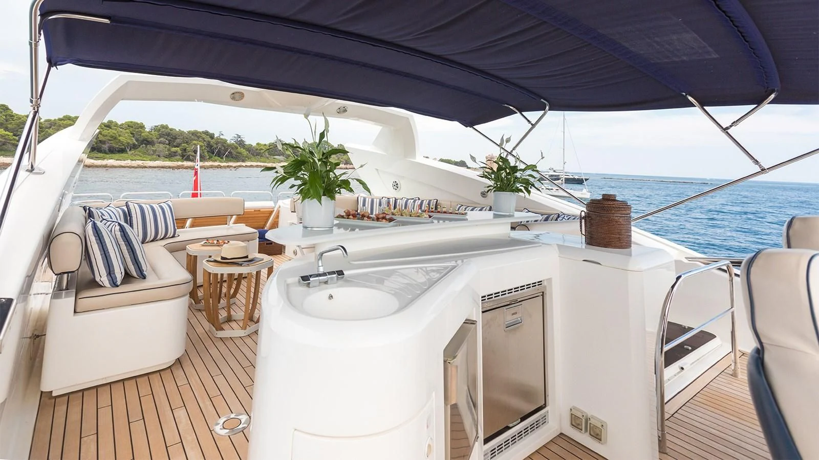 a white boat with a sink and chairs on a deck aboard WINNING STREAK 2 Yacht for Sale