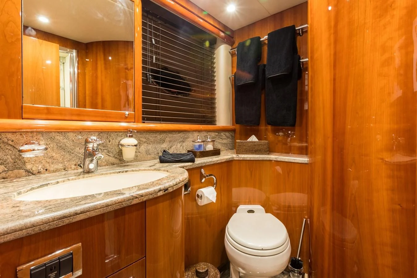 a bathroom with a toilet and sink aboard WINNING STREAK 2 Yacht for Sale