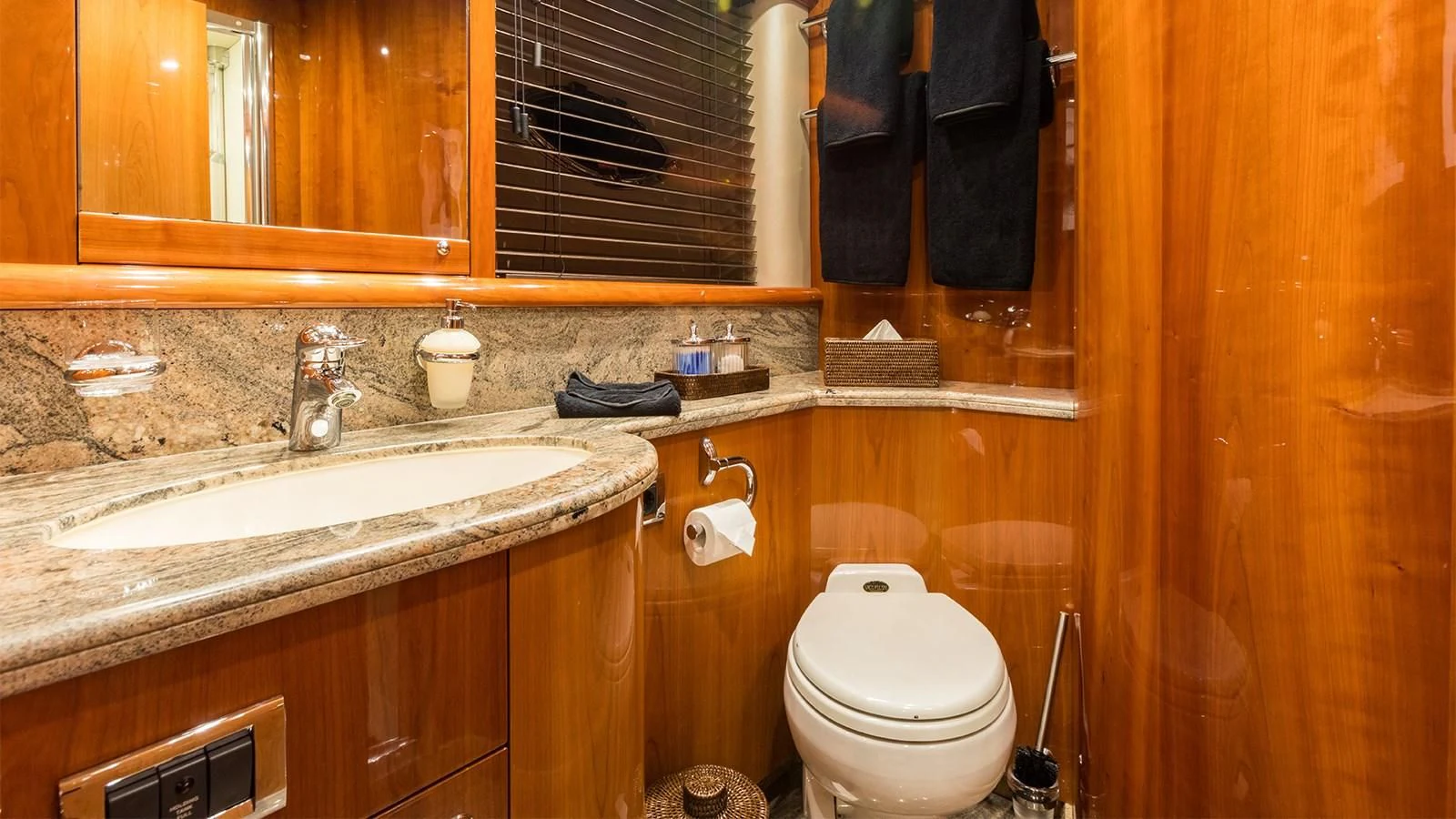 a bathroom with a toilet and sink aboard WINNING STREAK 2 Yacht for Sale
