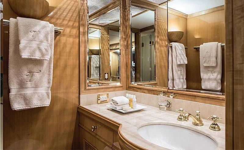 a bathroom with a sink and towels aboard SMITH Yacht for Sale
