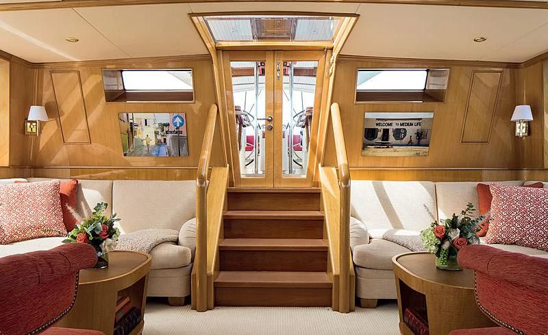 a room with a bed and a couch aboard SMITH Yacht for Sale