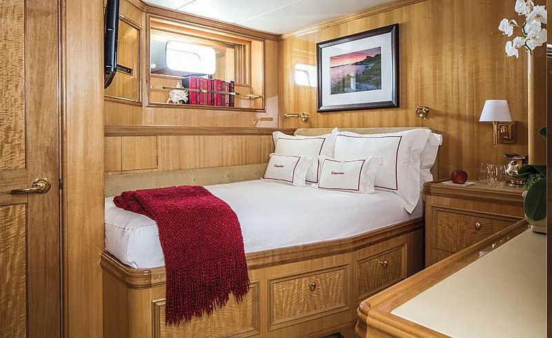 a room with a bed and a desk aboard SMITH Yacht for Sale