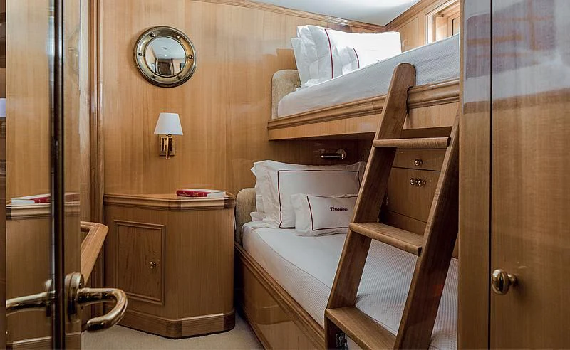 a bed and a dresser in a room aboard SMITH Yacht for Sale