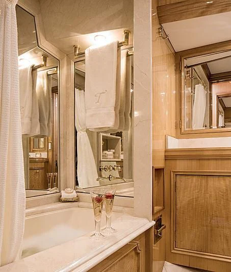a bathroom with a large mirror aboard SMITH Yacht for Sale