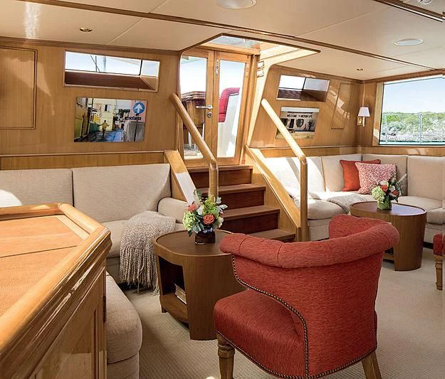 a living room with a staircase aboard SMITH Yacht for Sale