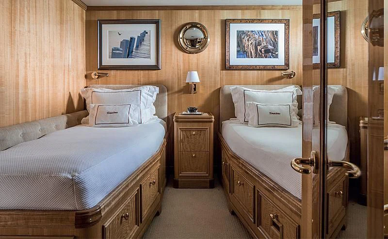 a bedroom with a bed and a mirror aboard SMITH Yacht for Sale