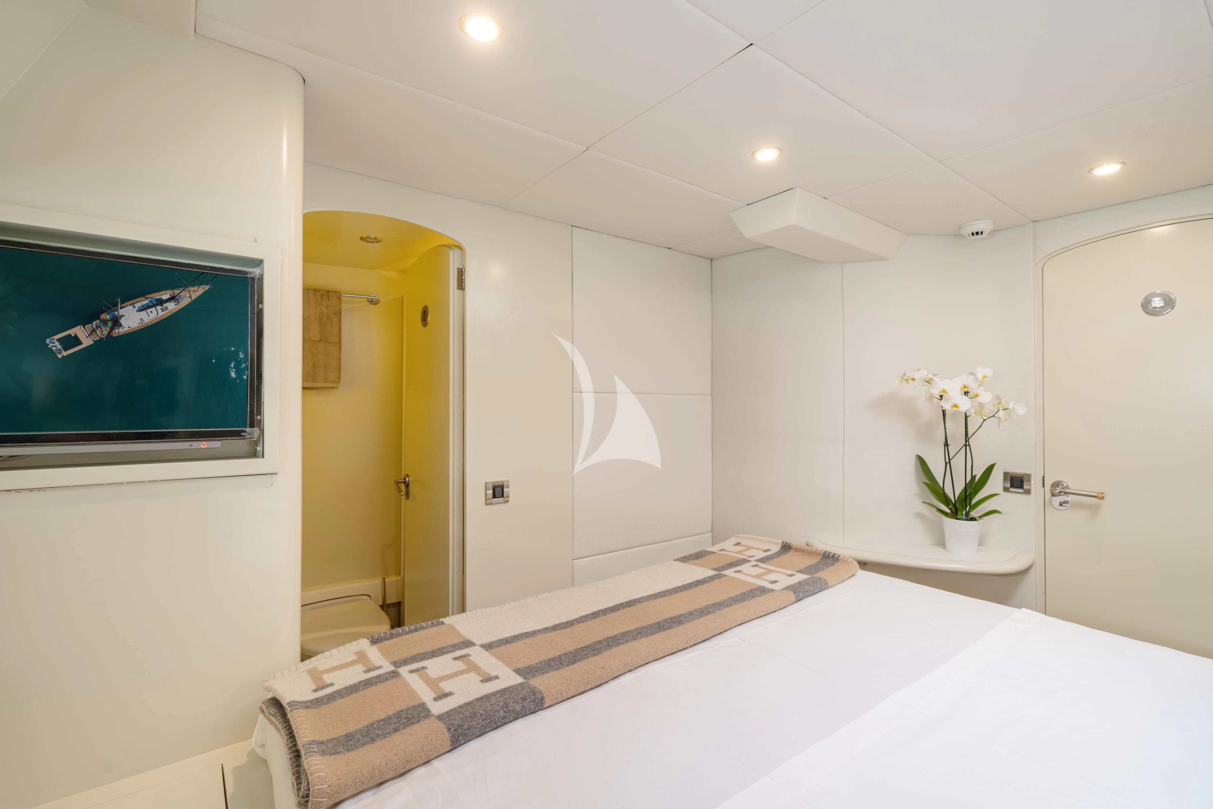 a room with a large mirror and a rug on the floor aboard ASHLEYROSE Yacht for Sale
