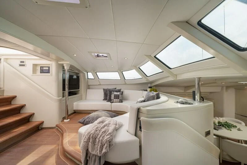 a room with a couch and a table aboard ASHLEYROSE Yacht for Sale