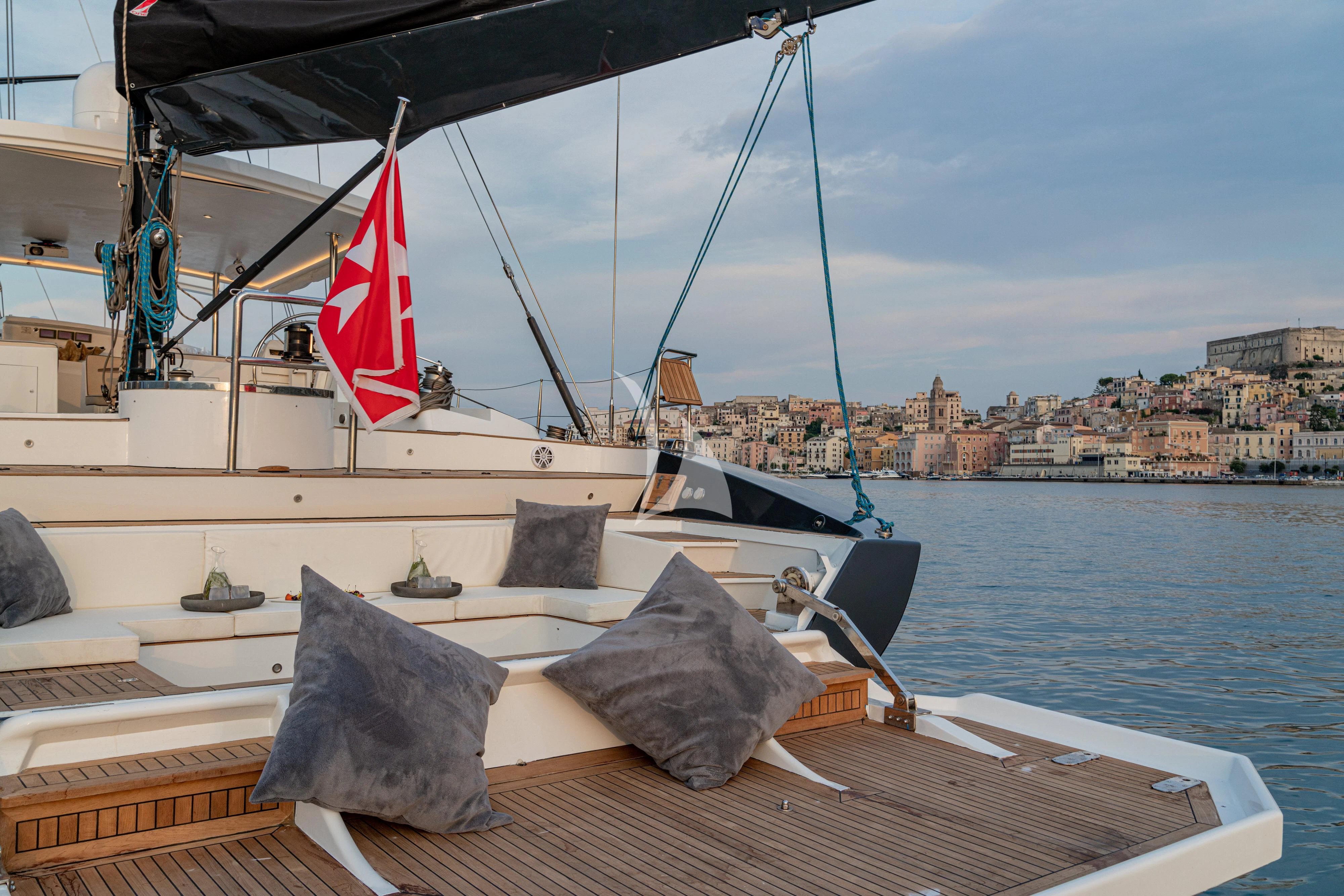 a boat with a flag on it aboard ASHLEYROSE Yacht for Sale