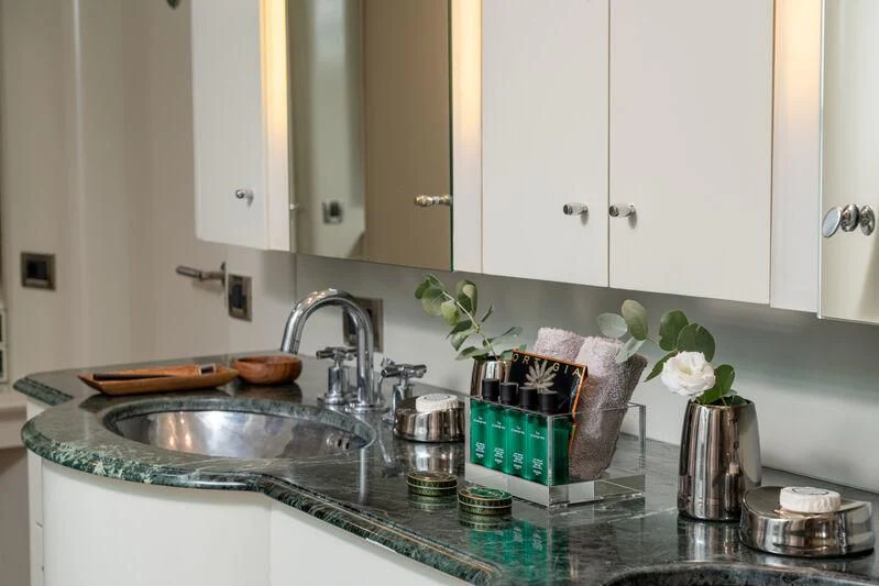 a kitchen counter with a sink and cabinets aboard ASHLEYROSE Yacht for Sale