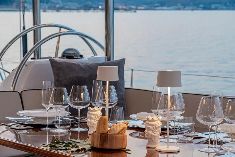 a table with a chair and a tray of food on it aboard ASHLEYROSE Yacht for Sale