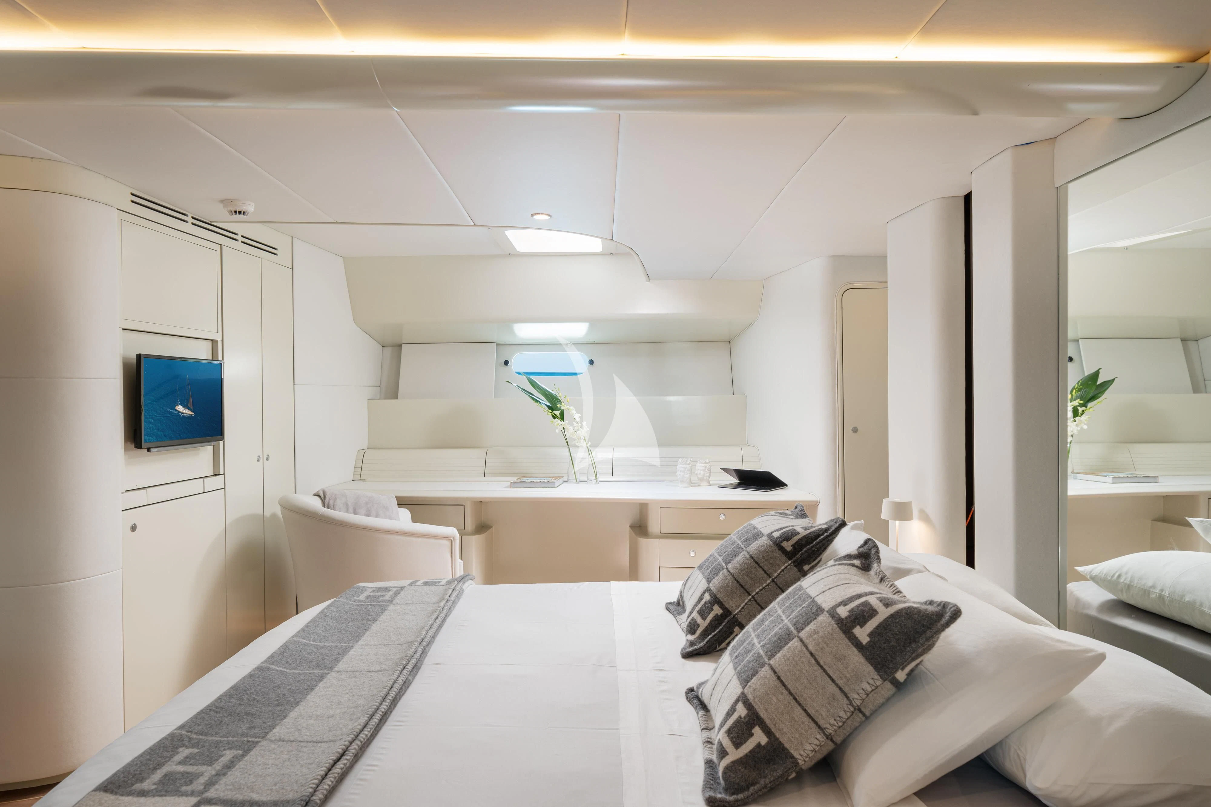 a room with a bed and a desk aboard ASHLEYROSE Yacht for Sale
