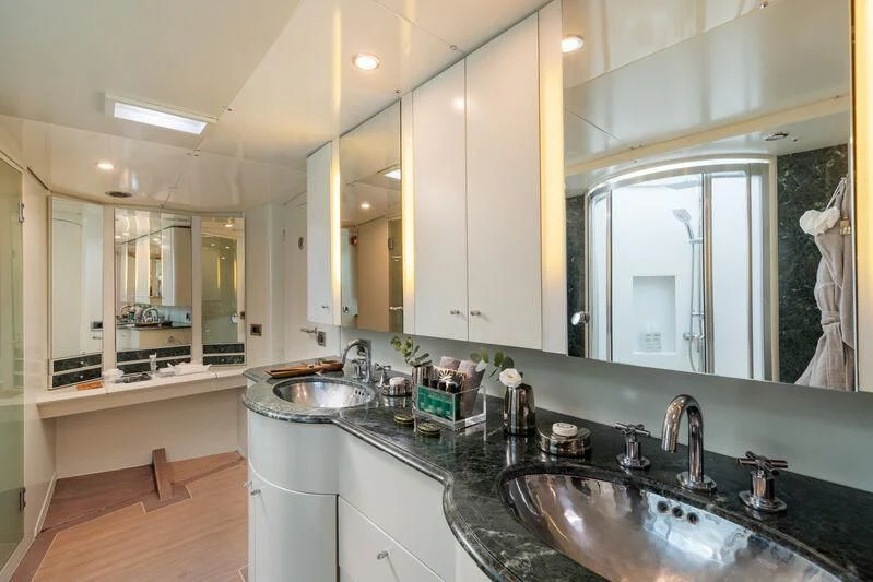 a bathroom with a countertop sink and a mirror aboard ASHLEYROSE Yacht for Sale
