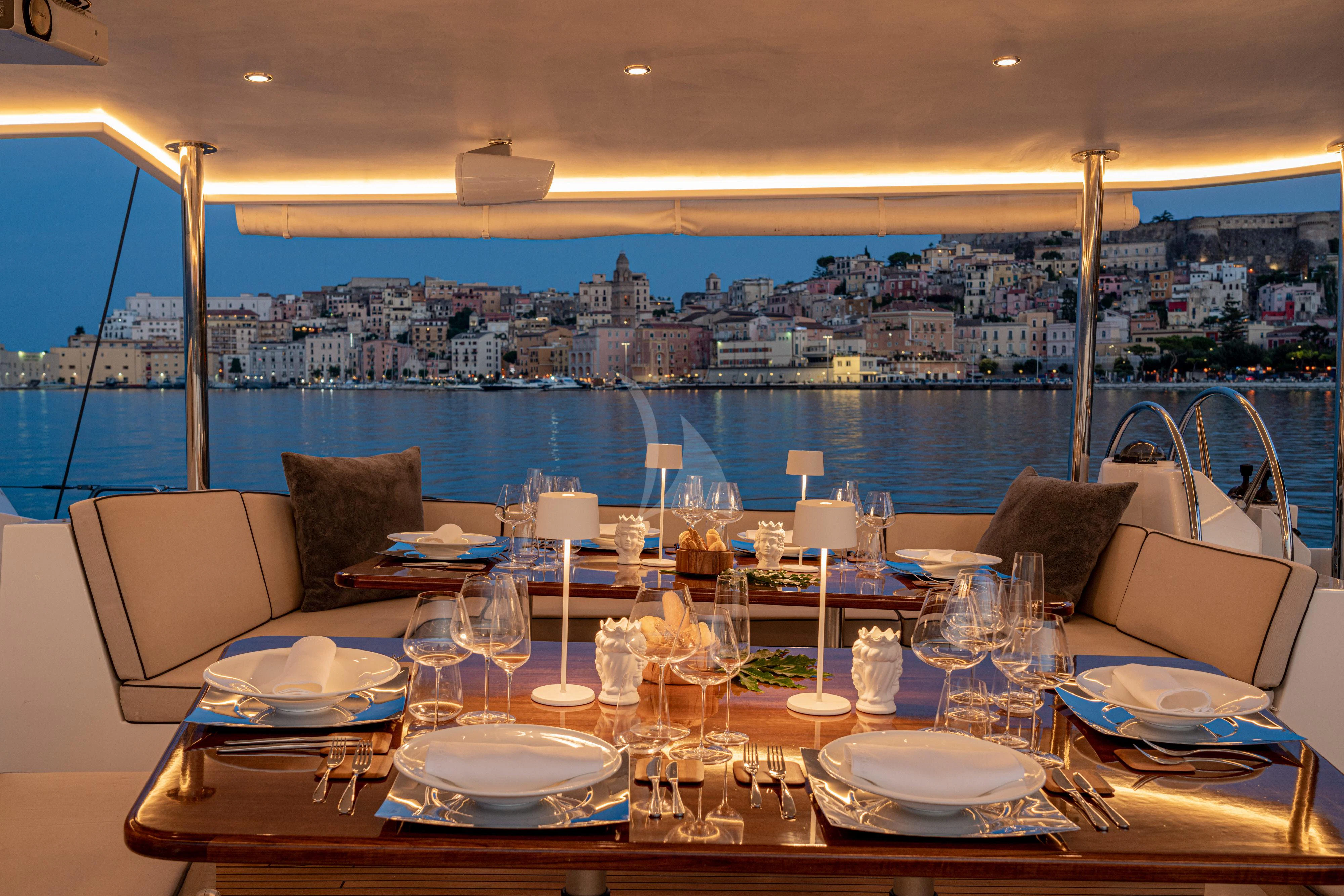 a table set for a dinner aboard ASHLEYROSE Yacht for Sale