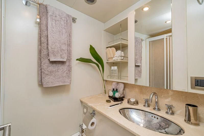 a bathroom with a sink and towels aboard ASHLEYROSE Yacht for Sale