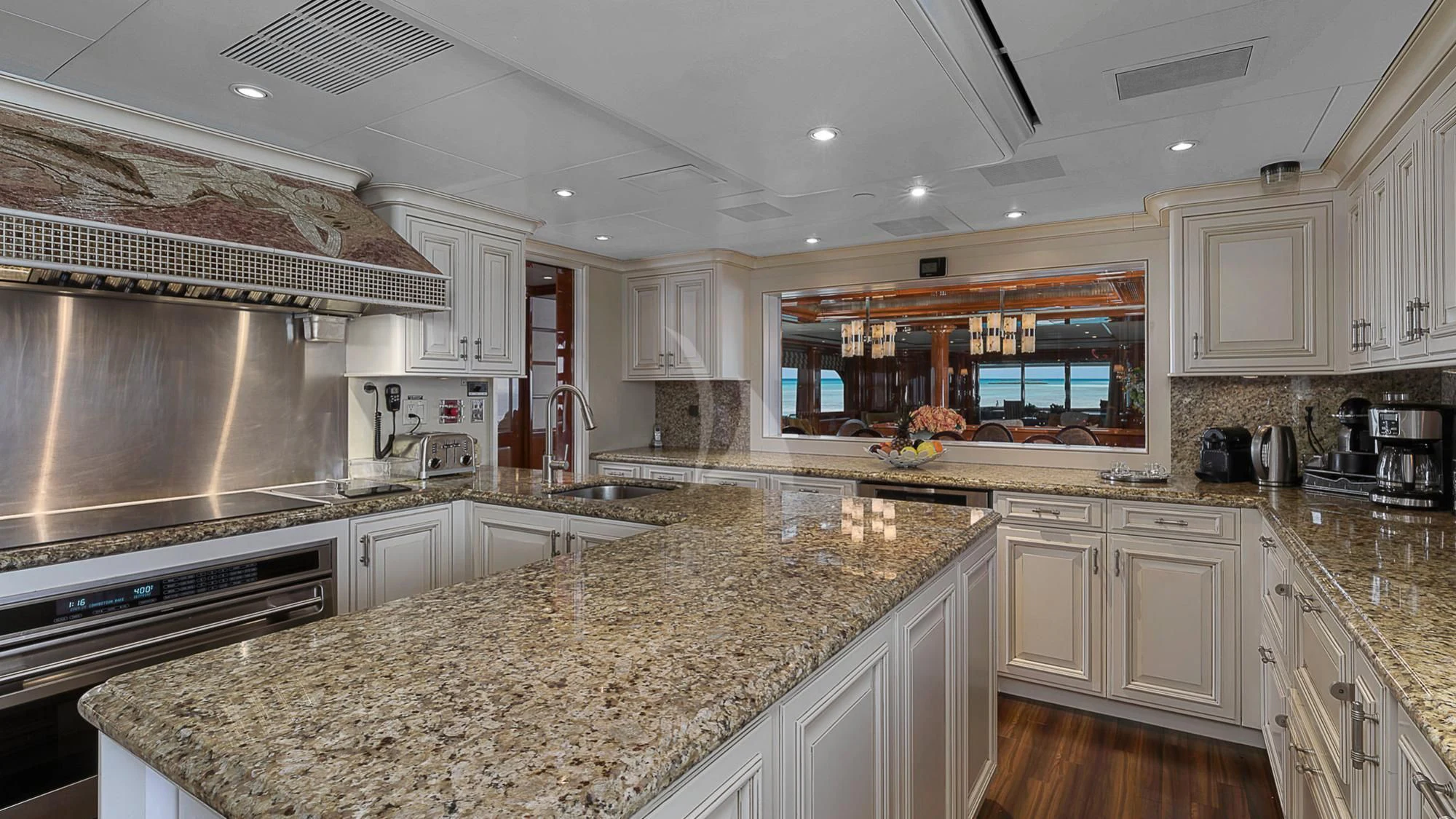 a large kitchen with marble counters aboard MILESTONE Yacht for Sale