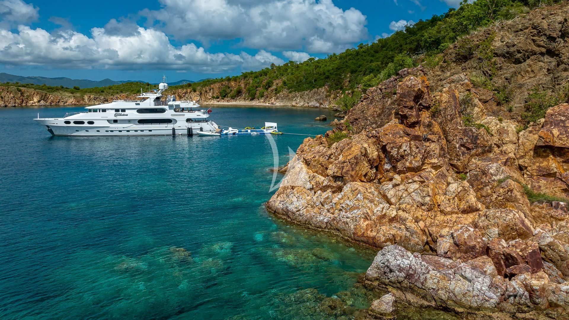 a boat sailing on the sea aboard MILESTONE Yacht for Sale