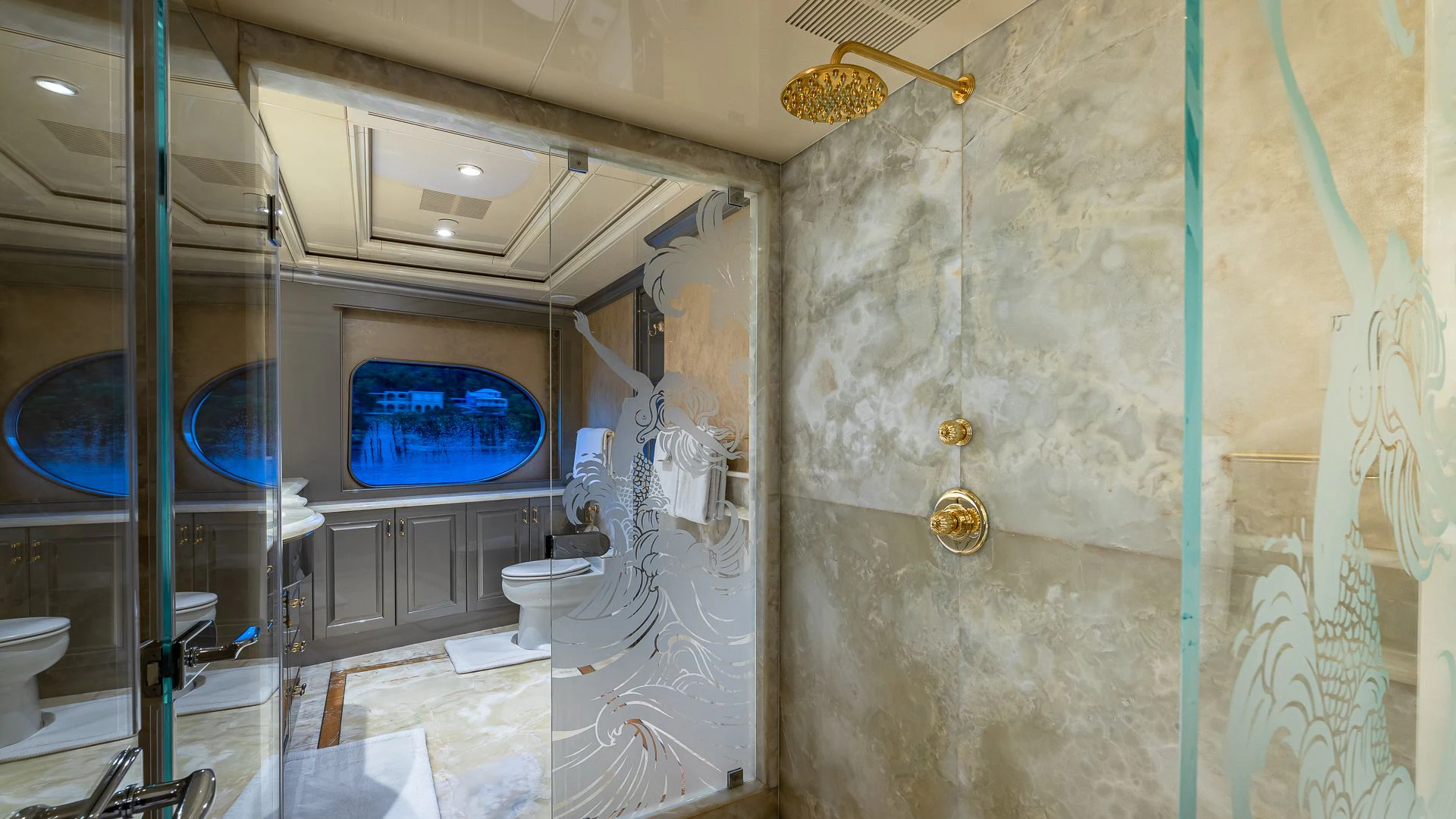 a bathroom with a glass shower aboard MILESTONE Yacht for Sale