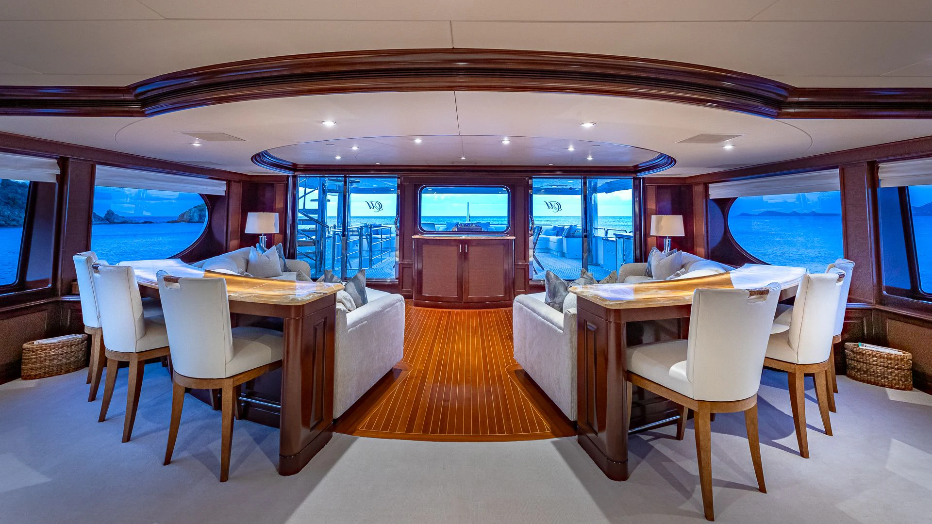 a room with tables and chairs aboard MILESTONE Yacht for Sale