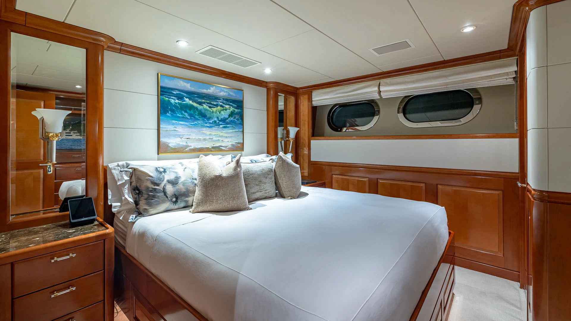 a bedroom with a bed and a desk aboard MILESTONE Yacht for Sale