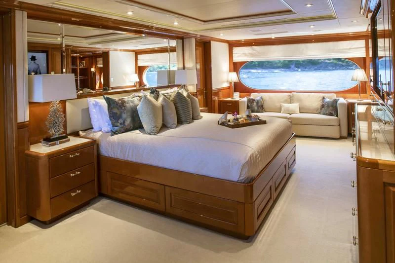 a large bed in a room aboard MILESTONE Yacht for Sale