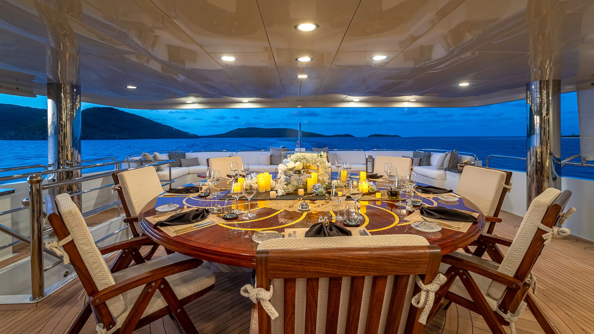 a table set for a dinner party aboard MILESTONE Yacht for Sale