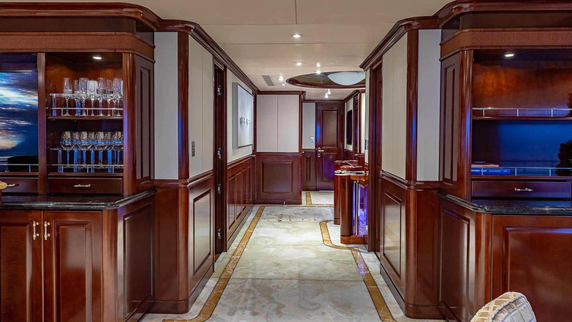 a room with a bar and cabinets aboard MILESTONE Yacht for Sale
