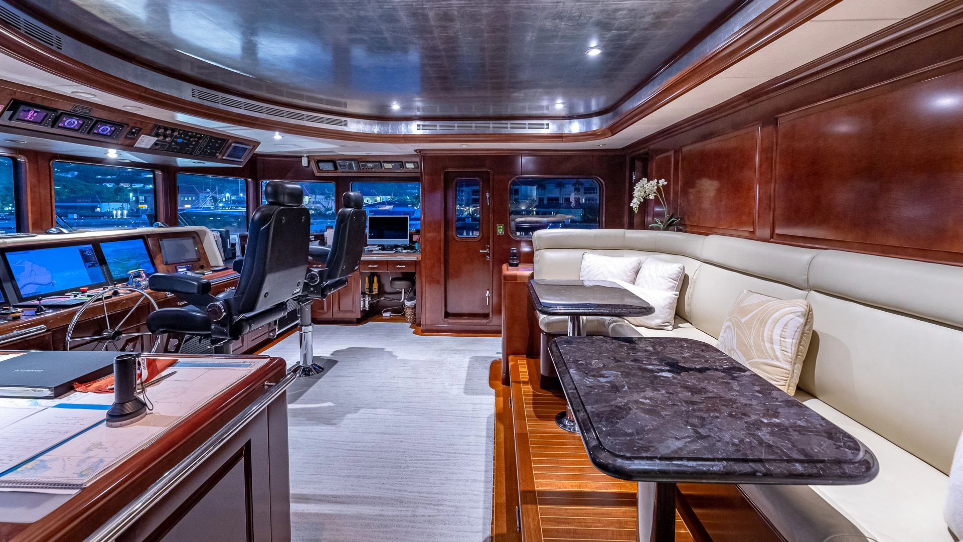 a room with a couch and a table aboard MILESTONE Yacht for Sale