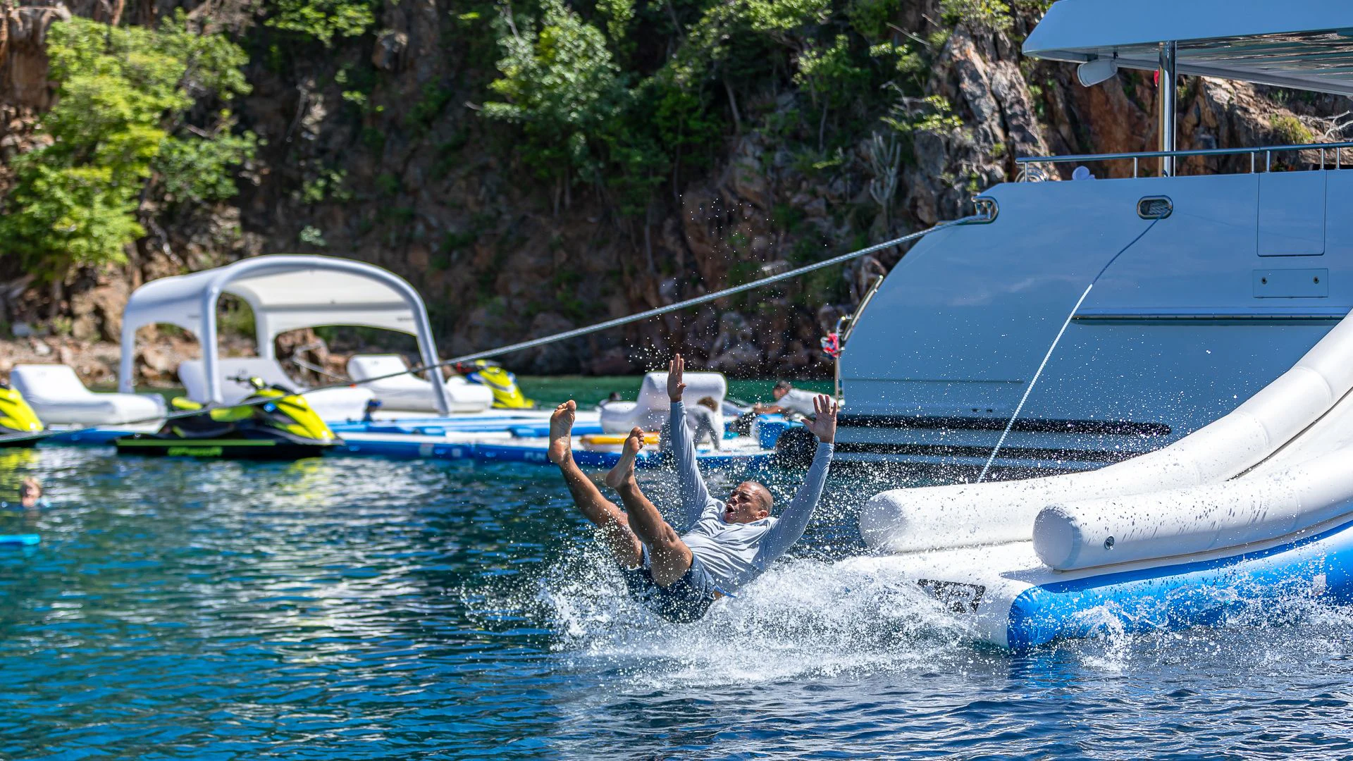a person jumping into the water aboard MILESTONE Yacht for Sale