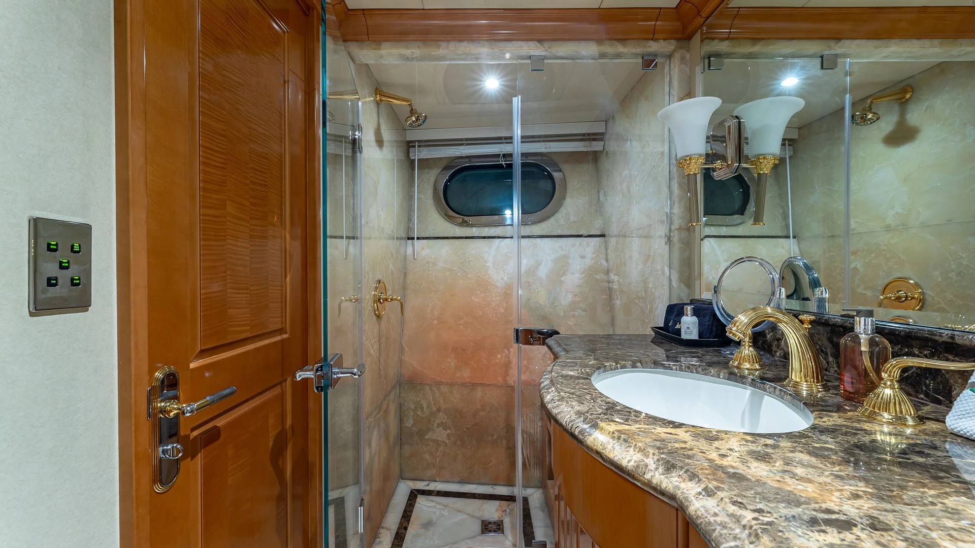 a bathroom with a sink and a shower aboard MILESTONE Yacht for Sale