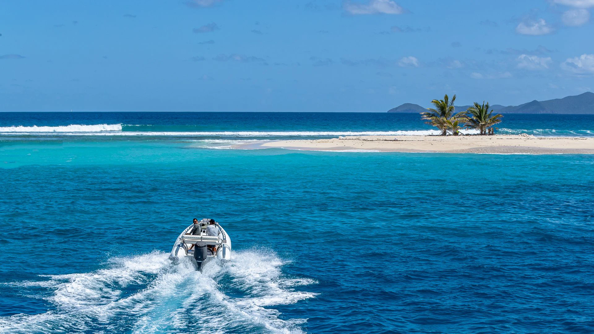 a person riding a jet ski on the ocean aboard MILESTONE Yacht for Sale