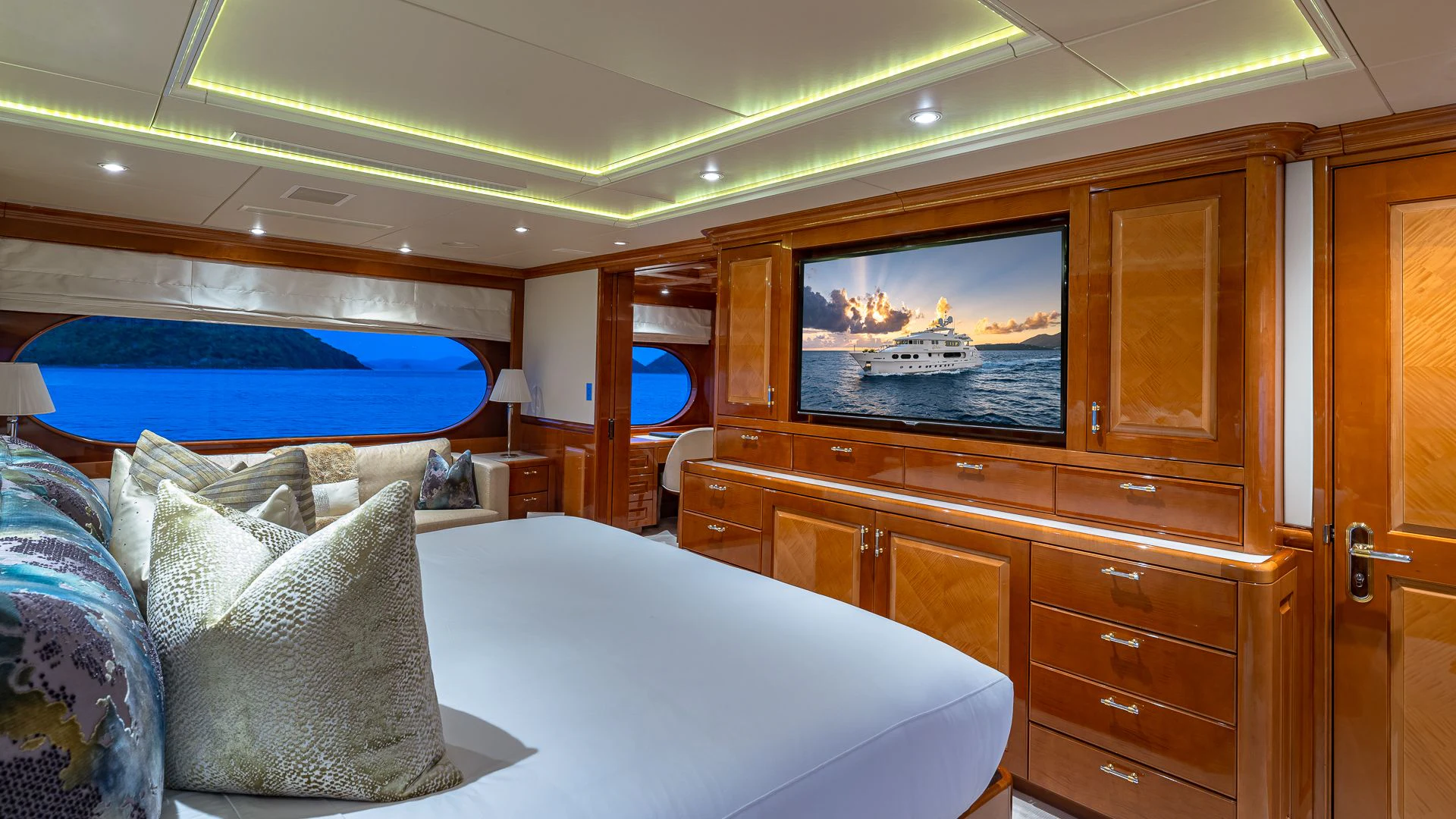 a room with a bed and a television aboard MILESTONE Yacht for Sale