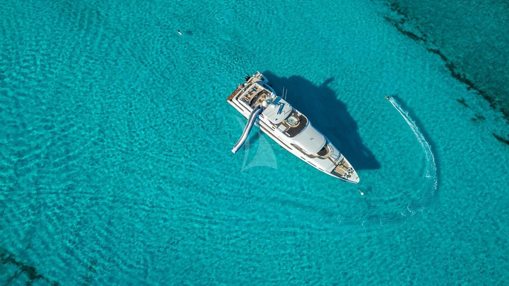 a small boat in a body of water aboard MILESTONE Yacht for Sale