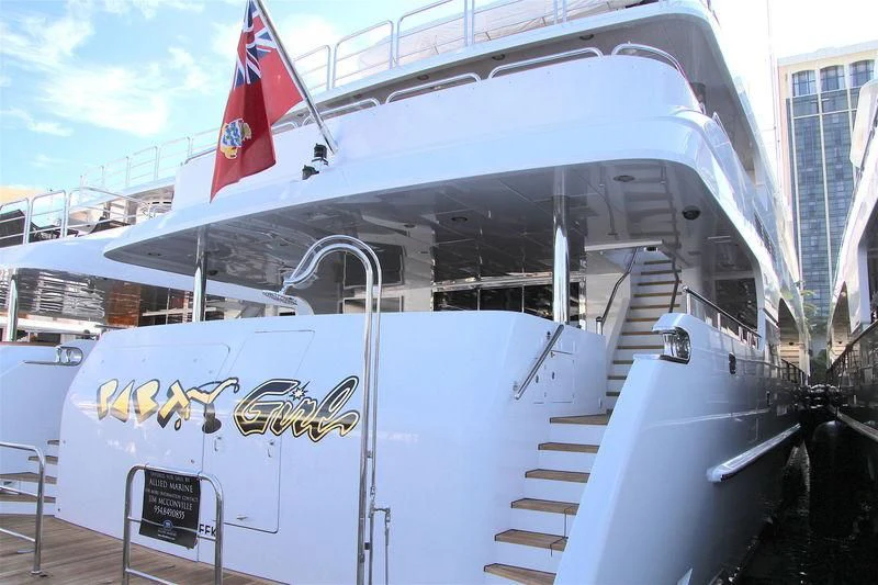 a boat with flags on the deck aboard MILESTONE Yacht for Sale