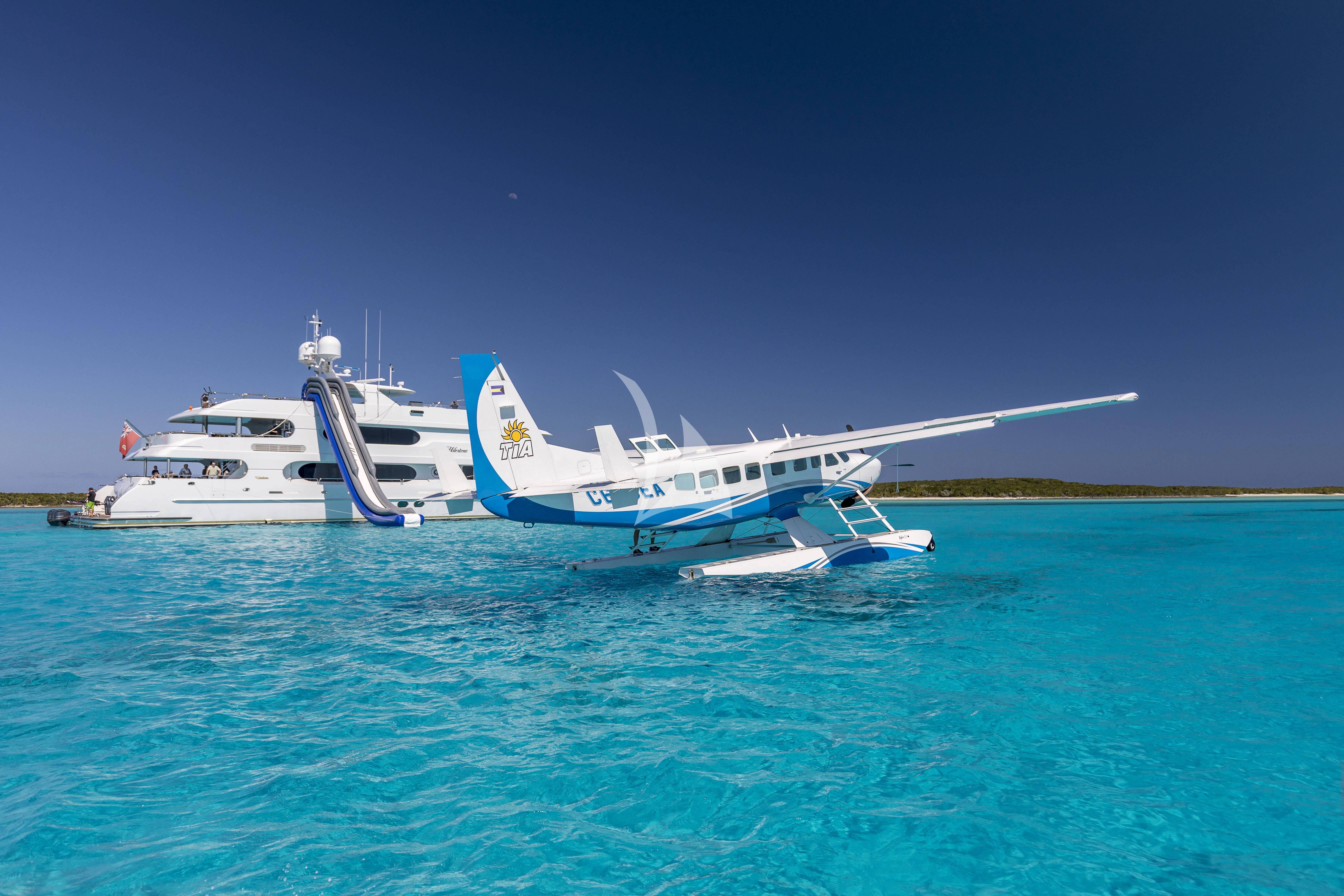 a plane on the water aboard MILESTONE Yacht for Sale