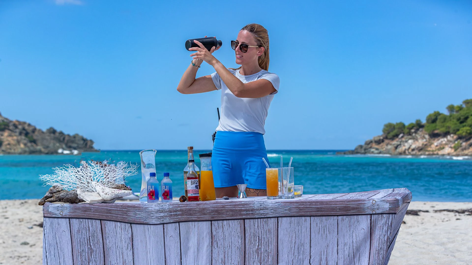 a woman holding a camera aboard MILESTONE Yacht for Sale