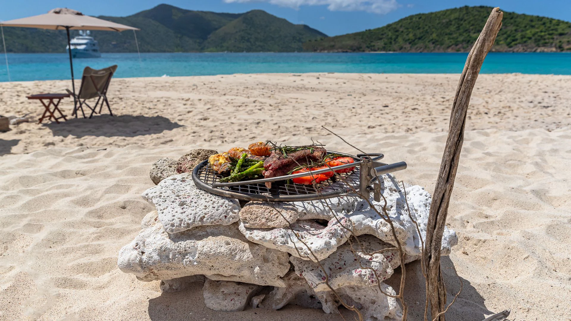 a picnic table on a beach aboard MILESTONE Yacht for Sale