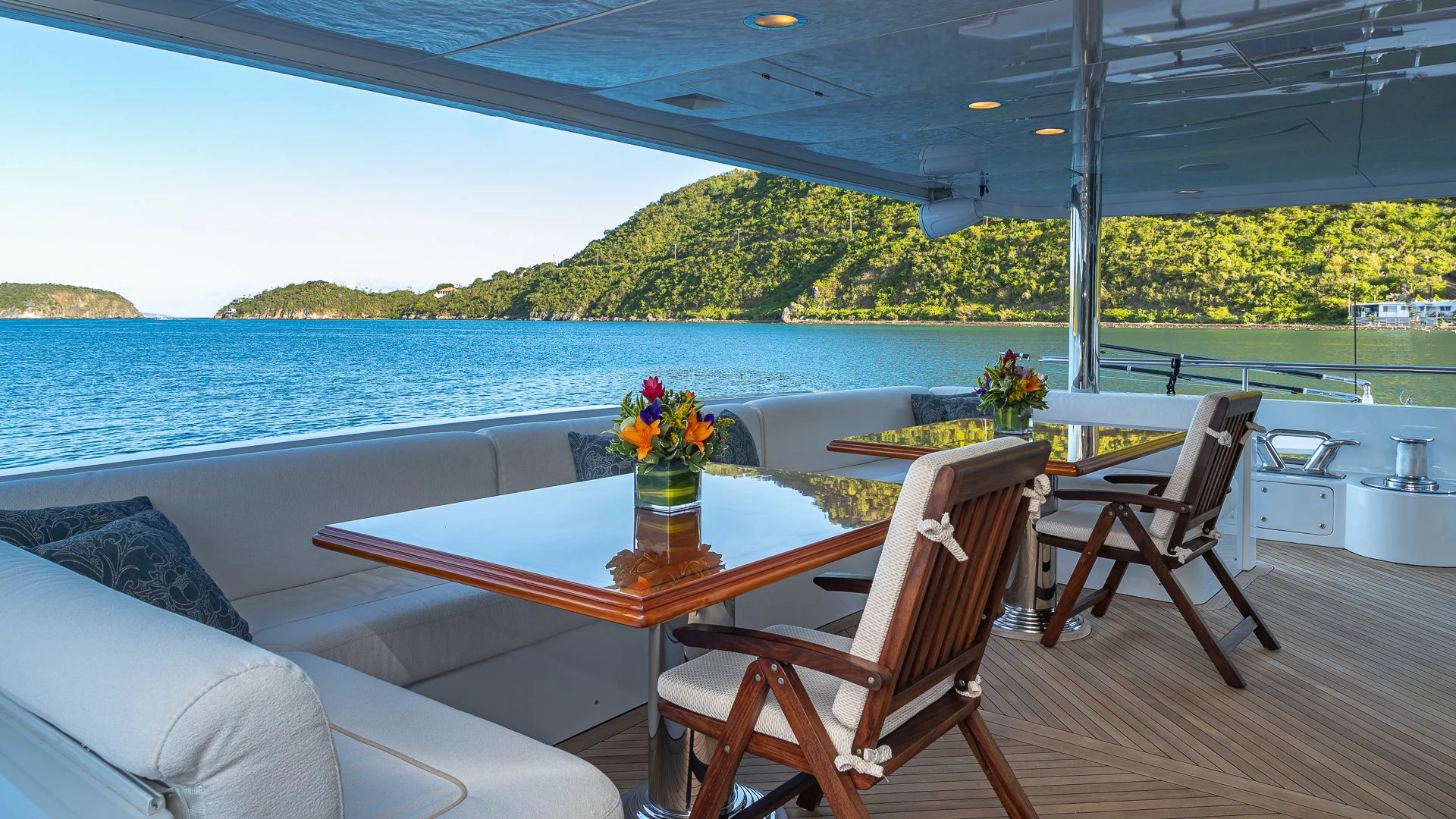 a table and chairs on a deck aboard MILESTONE Yacht for Sale