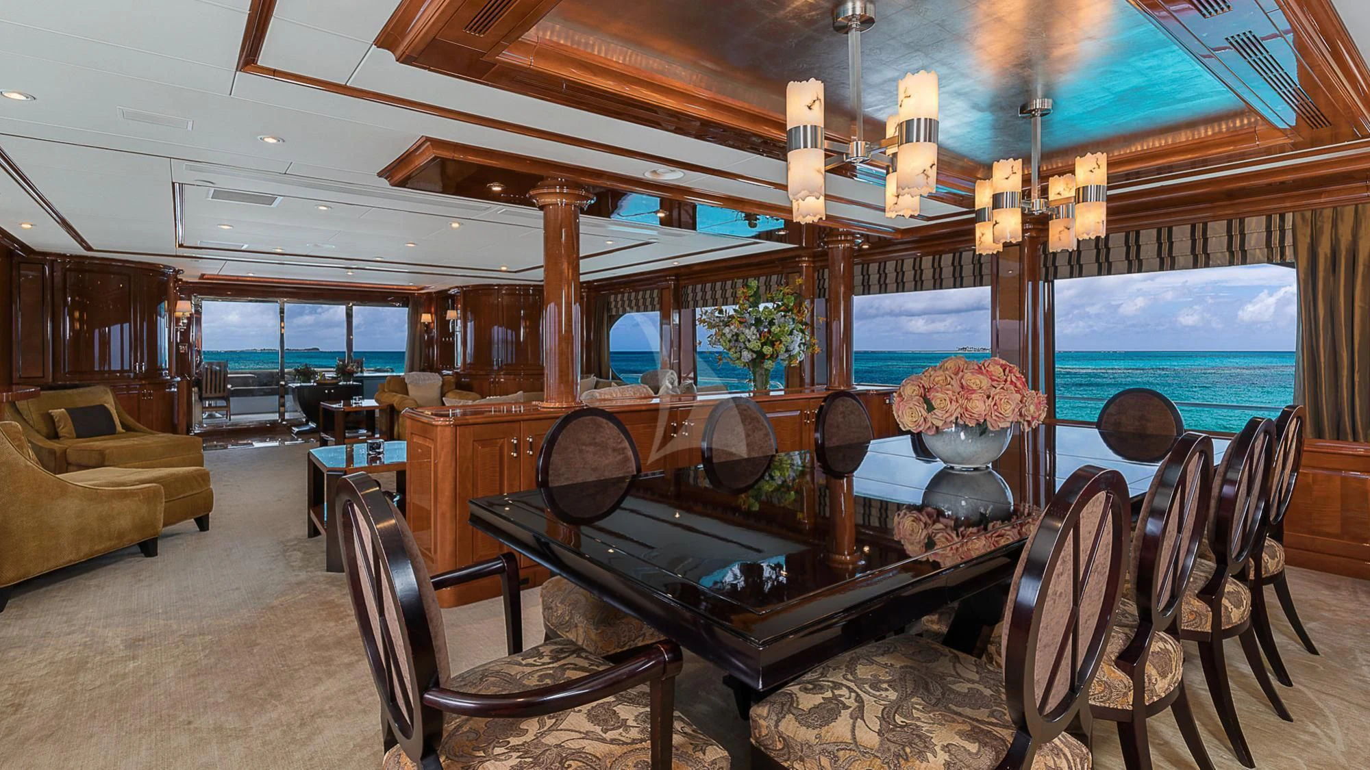 a large room with a table and chairs aboard MILESTONE Yacht for Sale