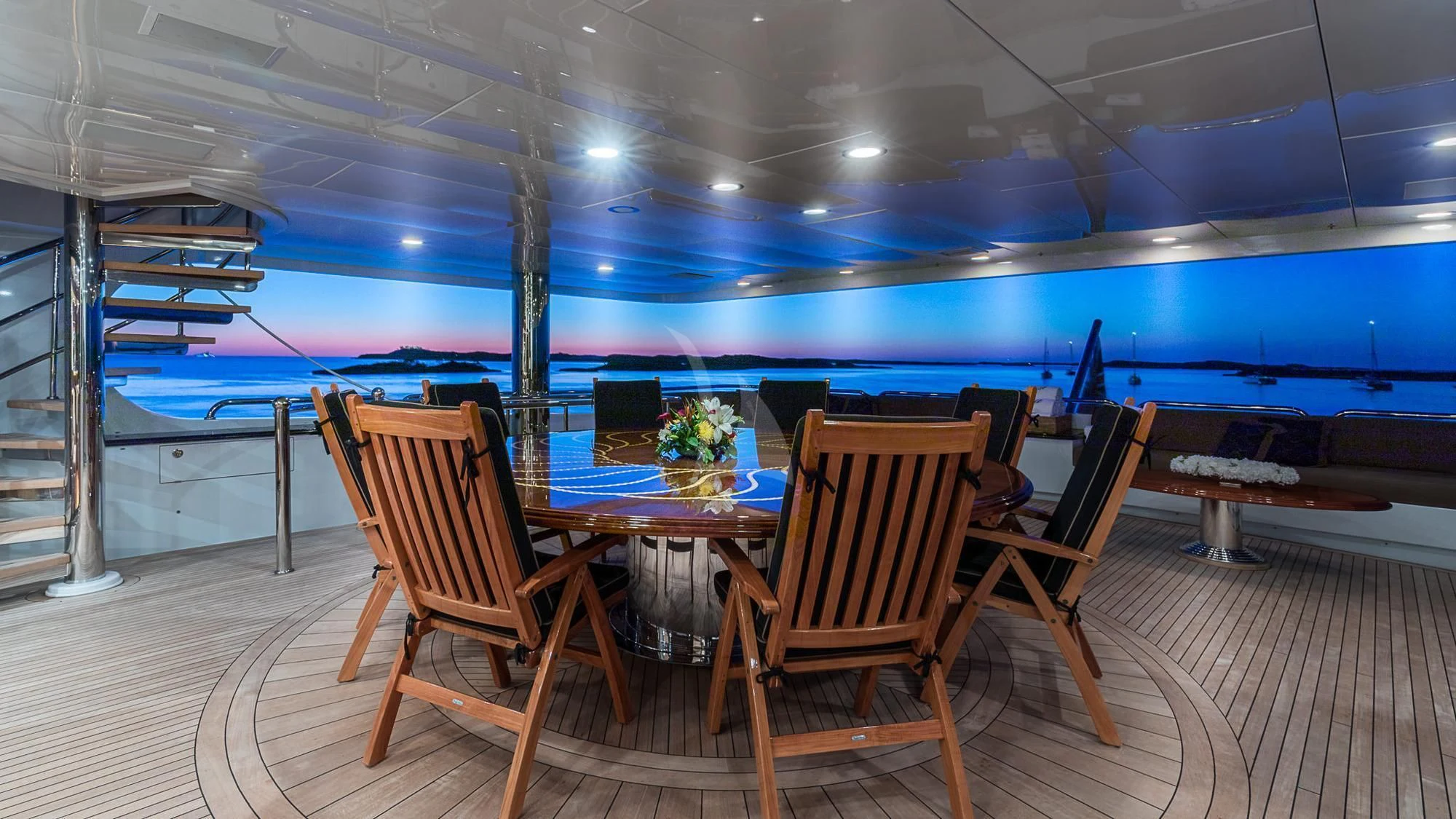 a room with a table and chairs aboard MILESTONE Yacht for Sale