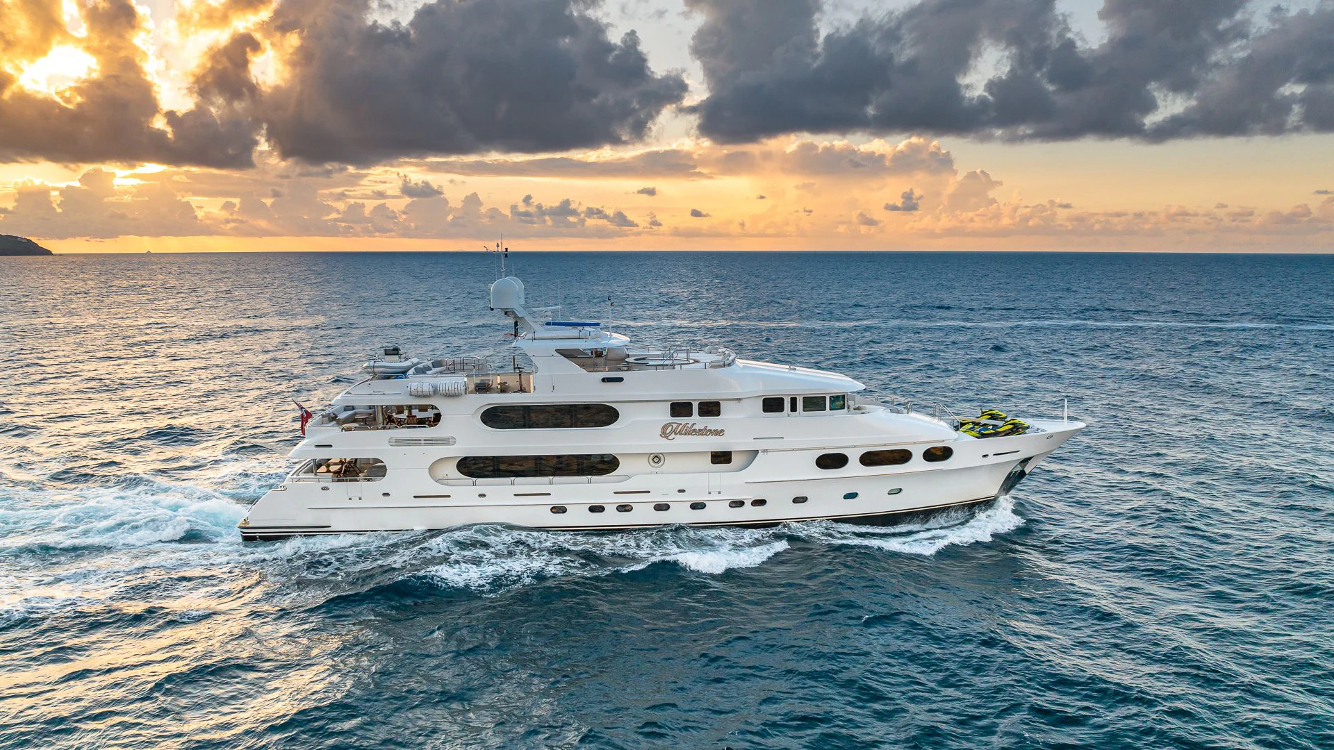 a white boat in the water aboard MILESTONE Yacht for Sale
