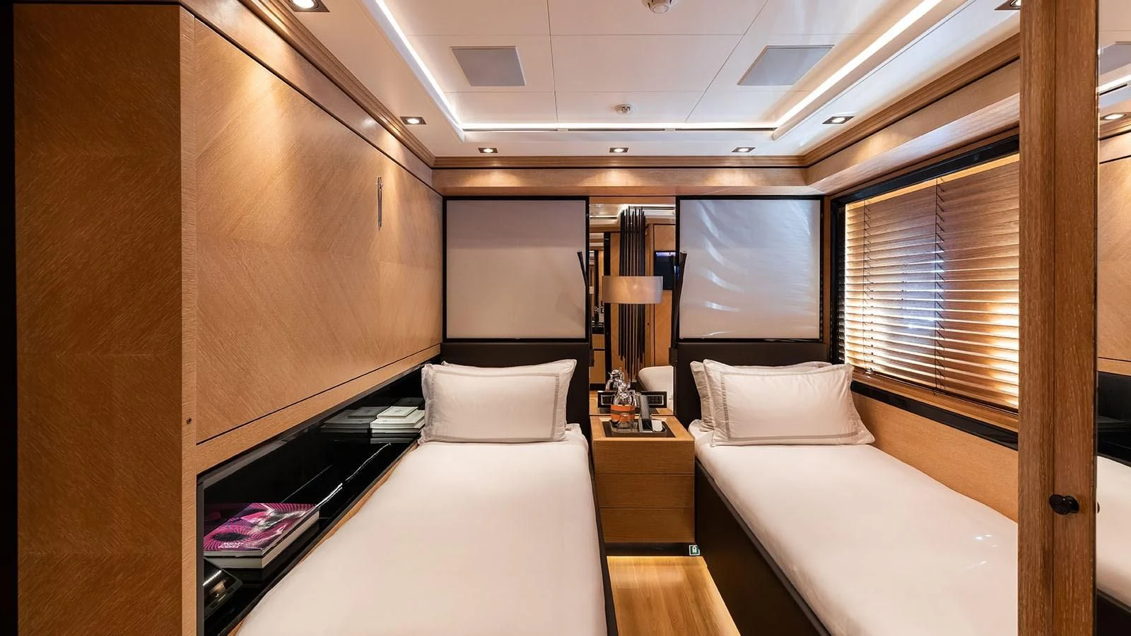 a room with a bed and a window aboard ALASKA Yacht for Sale