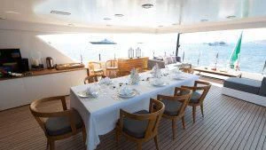 a dining room with tables and chairs aboard ALASKA Yacht for Sale