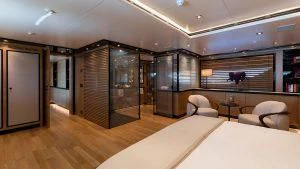 a room with a bed and a couch aboard ALASKA Yacht for Sale
